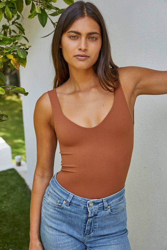 Yours Truly Bodysuit. rust colored bodysuit, bodysuit with snap, tight bodysuit, low cut bodysuit, tank top with snap closure